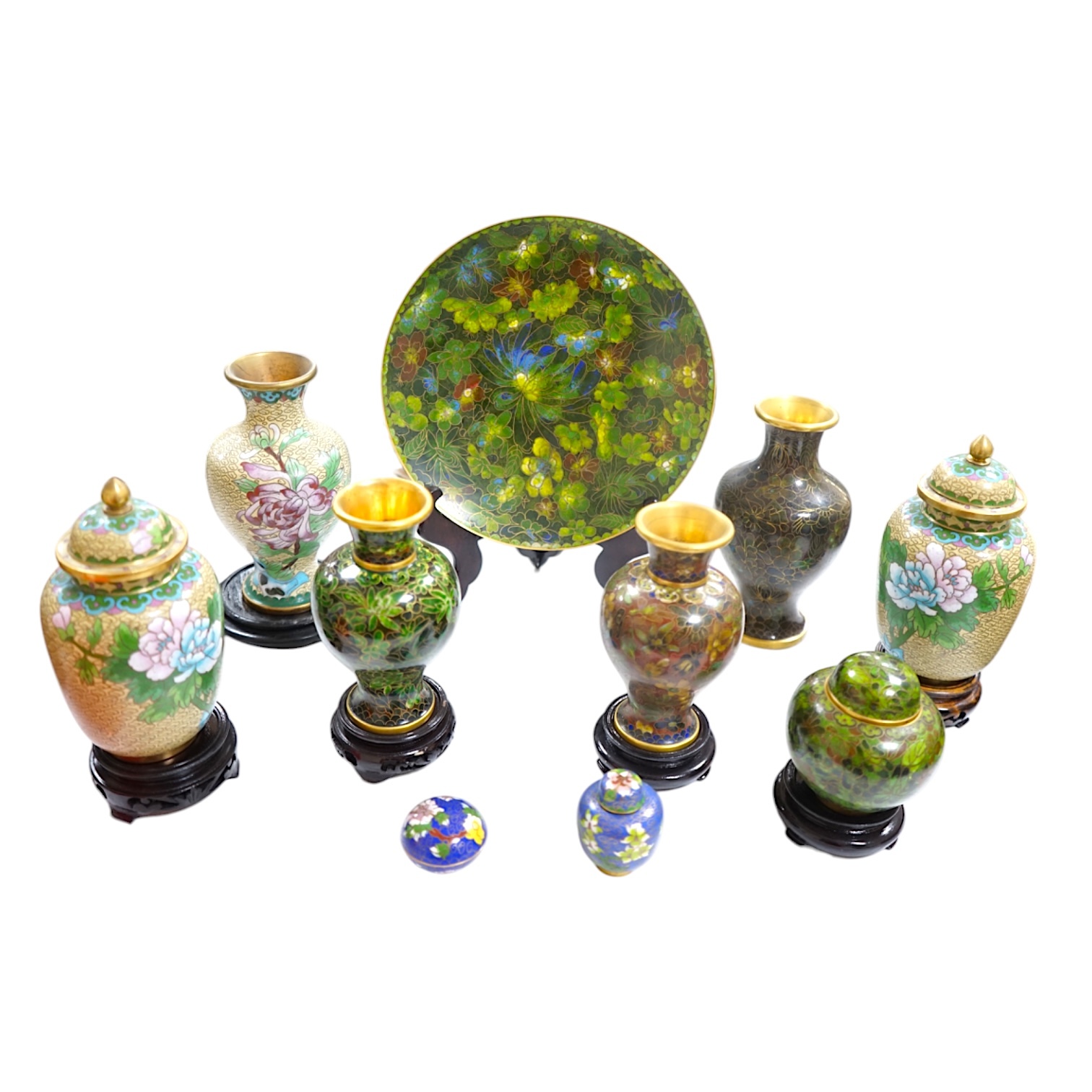 A collection of Chinese cloisonné enamel wares, with mixed coloured backgrounds, all with floral designs, some with stands, plate 21cm diameter. Condition - good